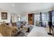 Comfortable living room with a large sectional sofa, decorative accents, and ample natural light at 15 Via Mantova # 308, Henderson, NV 89011