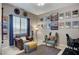 Cozy living room featuring comfortable seating, artwork, and scenic views at 15 Via Mantova # 308, Henderson, NV 89011