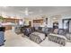 Spacious living area connected to kitchen, featuring modern decor, tile flooring and open layout at 15 Via Mantova # 308, Henderson, NV 89011