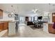 Open-concept living space with a blend of kitchen, dining, and living areas, great for entertaining at 15 Via Mantova # 308, Henderson, NV 89011