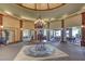 Elegant lobby area with a chandelier, pillars and luxurious finishes at 15 Via Mantova # 308, Henderson, NV 89011