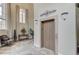 Elegant lobby features travertine floors, high ceilings, an elevator and tall windows at 15 Via Mantova # 308, Henderson, NV 89011