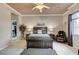 Spacious main bedroom featuring a large bed, seating area, and walk-in closet, creating a relaxing retreat at 15 Via Mantova # 308, Henderson, NV 89011