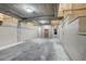 Well-lit parking garage featuring concrete ceilings, an elevator and white block walls at 15 Via Mantova # 308, Henderson, NV 89011