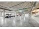 Brightly lit parking garage with ample space, concrete ceiling, and a view of manicured landscape at 15 Via Mantova # 308, Henderson, NV 89011