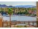 View of the lake from condo balcony with dock and boats and other homes in the community at 15 Via Mantova # 308, Henderson, NV 89011