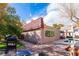 The backyard features an in-ground pool, outdoor dining, and lush greenery, perfect for year-round outdoor enjoyment at 1601 Becke Cir, Las Vegas, NV 89104