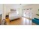 Bright bedroom with a modern platform bed, French doors, and wood-look flooring at 1601 Becke Cir, Las Vegas, NV 89104
