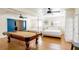 Open concept bedroom features a pool table, two queen beds, and hardwood floors at 1601 Becke Cir, Las Vegas, NV 89104