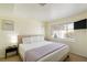 Bedroom featuring a king bed, neutral walls, bedside tables and lamps, plus carpeted floors at 1601 Becke Cir, Las Vegas, NV 89104