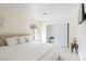 Bedroom features a plush king bed, neutral walls, bedside tables and lamps, with carpeted floors at 1601 Becke Cir, Las Vegas, NV 89104