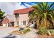 Charming two-story home featuring a red tile roof, lush landscaping, and a decorative fountain at 1601 Becke Cir, Las Vegas, NV 89104