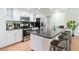 Well-lit kitchen featuring stainless steel appliances, granite countertops, and convenient barstool seating at 1601 Becke Cir, Las Vegas, NV 89104