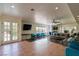 Bright living room with french doors, tile accents, ceiling fan, and comfortable seating arrangement at 1601 Becke Cir, Las Vegas, NV 89104
