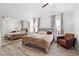 Serene bedroom features mirrored closet doors, and a ceiling fan, creating a comfortable retreat at 1892 Falcon Ridge St, Las Vegas, NV 89142