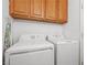 Functional laundry room equipped with a washer and dryer, ready to simplify household chores at 1892 Falcon Ridge St, Las Vegas, NV 89142