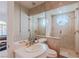 The bathroom features a glass-enclosed shower with a unique window, complemented by modern fixtures and tile work at 2339 Prometheus Ct, Henderson, NV 89074