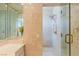 Modern bathroom featuring glass shower door and gold fixtures at 2339 Prometheus Ct, Henderson, NV 89074