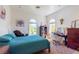 Bright bedroom featuring two arched windows, blue bedding, and white walls at 2339 Prometheus Ct, Henderson, NV 89074
