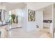 Elegant home foyer featuring neutral tile flooring and an arched entrance to the kitchen at 2339 Prometheus Ct, Henderson, NV 89074