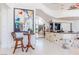 Elegant foyer with high ceilings, modern art, and a bar area leading to an upper level with an ornate railing at 2339 Prometheus Ct, Henderson, NV 89074