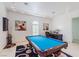 Game room features a billiard table, desk, and unique decor with bright lighting at 2339 Prometheus Ct, Henderson, NV 89074
