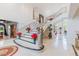 Grand foyer with winding staircase, large potted plants, and view into dining room at 2339 Prometheus Ct, Henderson, NV 89074