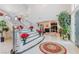 Grand foyer featuring a winding staircase adorned with red floral arrangements and decorations at 2339 Prometheus Ct, Henderson, NV 89074