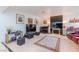 The living room features tile floors, comfortable seating, and a piano at 2339 Prometheus Ct, Henderson, NV 89074