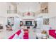 Spacious living room boasts a central bar area, comfortable seating, and a balcony overlooking the living space at 2339 Prometheus Ct, Henderson, NV 89074