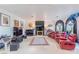 This living room features theater seats, multiple windows, and a sleek entertainment center at 2339 Prometheus Ct, Henderson, NV 89074