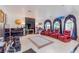 This living room features floor tile, comfortable seating, and a piano at 2339 Prometheus Ct, Henderson, NV 89074