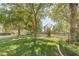 Community park featuring a playground surrounded by mature trees and grassy lawn at 2339 Prometheus Ct, Henderson, NV 89074
