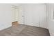 Bright bedroom with neutral carpet, white walls and trim, and a closet at 2547 Wolverton Ave, Henderson, NV 89074