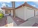 Charming single-story home with a two-car garage, desert landscaping, and mature palm trees at 2547 Wolverton Ave, Henderson, NV 89074