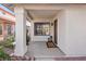 Charming front porch featuring stylish lanterns, decorative plants, and a welcoming entrance to the home at 2547 Wolverton Ave, Henderson, NV 89074