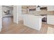 Modern kitchen featuring an island, sleek countertops, and stainless steel appliances, perfect for culinary enthusiasts at 2547 Wolverton Ave, Henderson, NV 89074