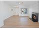 Spacious living room featuring a fireplace, natural light, and modern flooring, creating a welcoming space at 2547 Wolverton Ave, Henderson, NV 89074