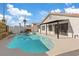 Beautiful backyard pool and spa area with covered patio in a well maintained yard at 2547 Wolverton Ave, Henderson, NV 89074