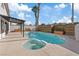Backyard pool and spa area with covered patio, and modern horizontal wood fence at 2547 Wolverton Ave, Henderson, NV 89074