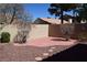 Private backyard retreat with low maintenance landscaping, rock features, and custom patio at 2744 Pala Dura Dr, Henderson, NV 89074
