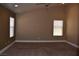 Spacious bedroom featuring neutral tones and natural light with ceiling fan at 2744 Pala Dura Dr, Henderson, NV 89074