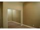 Bedroom with mirrored closet doors and neutral carpet at 2744 Pala Dura Dr, Henderson, NV 89074