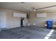 Spacious garage featuring ample storage, water filtration system, and easy access with a service door at 2744 Pala Dura Dr, Henderson, NV 89074