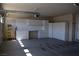 Well-organized garage space with white cabinets, a work desk, and ample storage solutions at 2744 Pala Dura Dr, Henderson, NV 89074