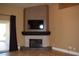 Living room featuring a modern fireplace with a mounted television and backyard access at 2744 Pala Dura Dr, Henderson, NV 89074