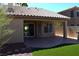 Inviting covered patio with outdoor seating and lush landscaping creating a relaxing retreat at 2744 Pala Dura Dr, Henderson, NV 89074