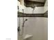 Shower with tile accents, multiple shower heads, and a corner shelf at 2744 Pala Dura Dr, Henderson, NV 89074
