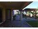 A beautifully landscaped backyard features an outdoor kitchen at 2822 Poseidon Shore Ave, Henderson, NV 89052