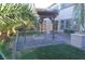 A beautifully landscaped backyard features a fire pit and pergola at 2822 Poseidon Shore Ave, Henderson, NV 89052